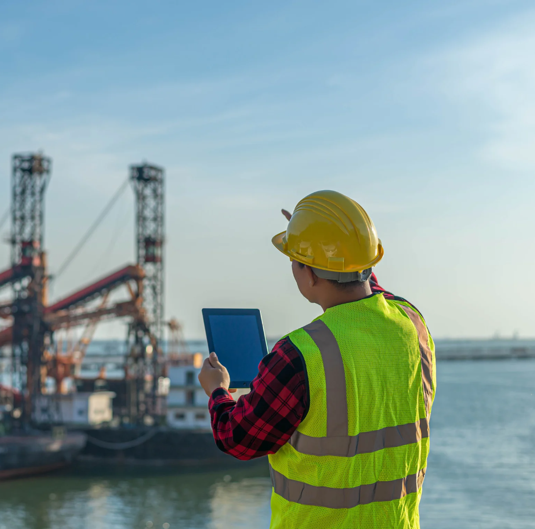 A marine operations worker with a walkie-talkie